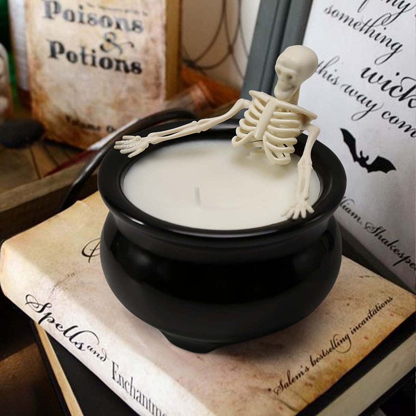 Skeleton in witch's cauldron candle