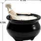 Skeleton in witch's cauldron candle